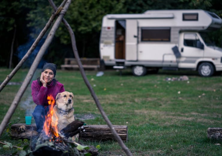 woman-and-dog-camping-RMBHD8X.jpg